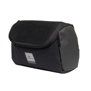 The Rip Curl F-Light Toiletry Midnight is a black, water-resistant polyester bag with a flap closure and a small front logo patch. It boasts a sleek design with a lightly textured top and smooth sides, blending style and practicality.