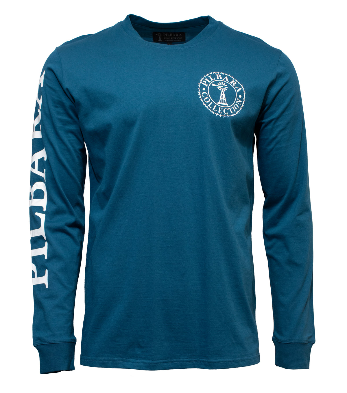 The Pilbara Long Sleeve T-Shirt is a casual blue top with a round neck, made from 100% cotton. It has "Pulaski" in white on the left sleeve and a circular logo with "Pulaski Collection" around a tree on the upper left chest. Ideal for relaxed days.