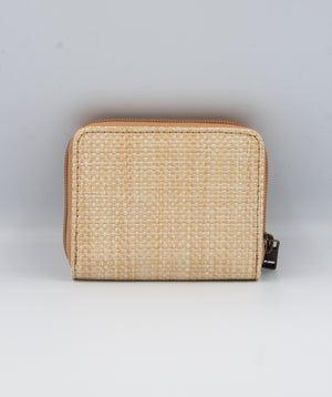 A beige Rip Curl Sunset Palms Mid Sized Wallet is shown on a light gray background. It features a zip-around closure with a metallic zipper pull on the right side, and its textured material offers an elegant and minimalist look.