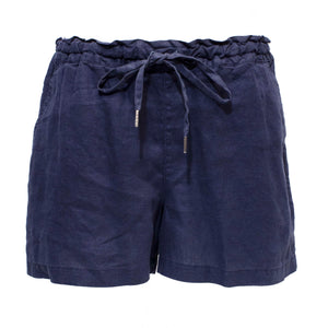 The Pilbara Ladies Linen Short in navy blue features an elasticized ruffled waistband and a drawstring tie, offering a relaxed fit. It's crafted from 100% lightweight linen for comfort.
