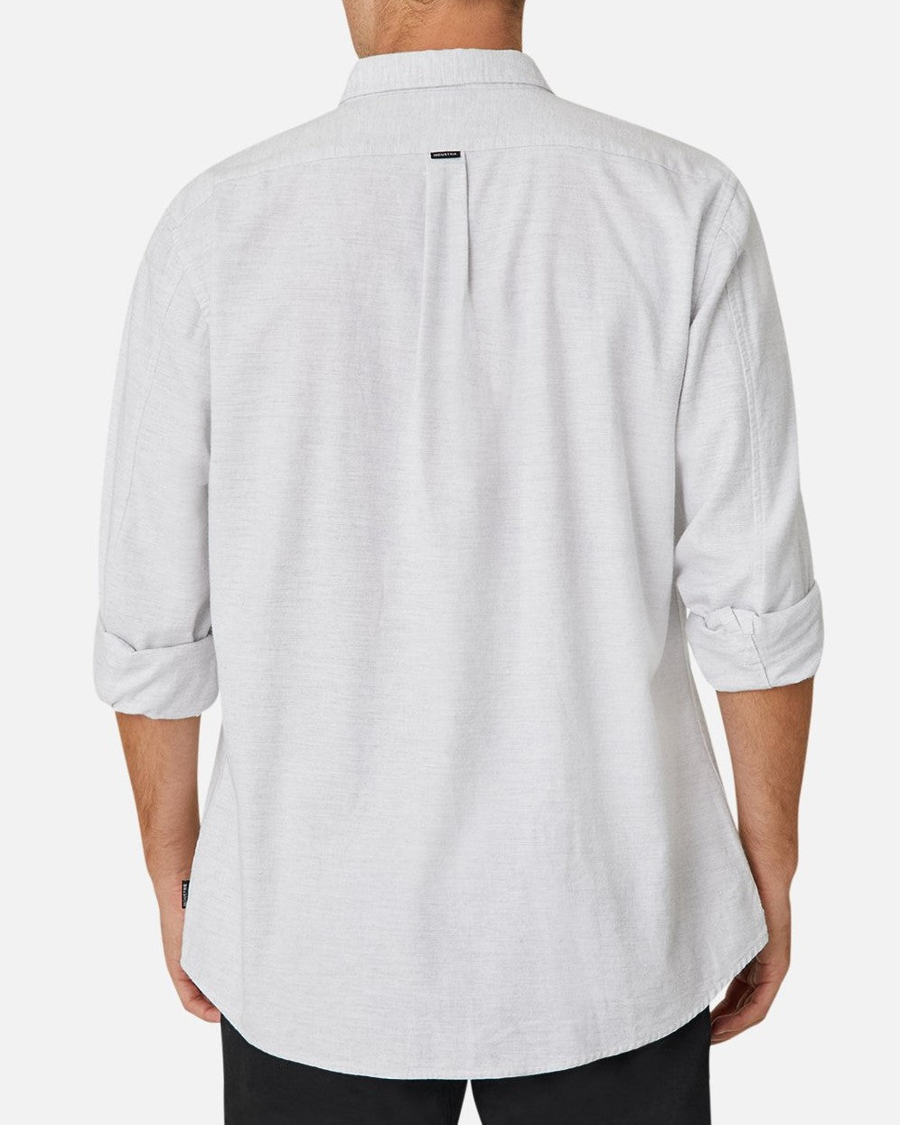 A person is wearing a light gray, long-sleeved Industrie The Taylor Shirt with the sleeves rolled up. This comfortable and casual shirt features a straight back yoke with a small pleat in the center and a small tag near the neck. The person is also sporting black pants against a plain white background.