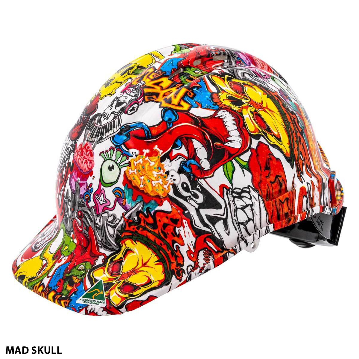 The SSA Custom Hydro Dip Hard Hat Vented features a vibrant, graffiti-style design with colorful illustrations such as skulls, eyes, and various abstract shapes and characters. The "Mad Skull" design label is located at the bottom left of the image. This hard hat is Australian Made and AS/NZS 1801:1997 certified.