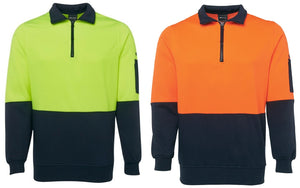 Two JB's Hi Vis 1/2 Zip Fleecy sweatshirts are shown. The left one is fluorescent yellow with a black lower half and sleeves; the right one is fluorescent orange with a black lower half and sleeves. Made from durable polyester cotton, they feature a quarter-zip collar and a pen pocket on the upper sleeve, perfect for workwear.
