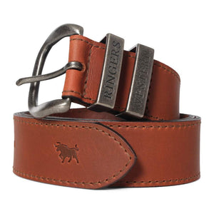 The Ringers Western James Belt is a genuine leather accessory with a metallic buckle, showcasing two metal tags embossed with "RINGERS" and "WESTERN." This Australian Made belt is stamped with the silhouette of a bull at the end, epitomizing its Ringers Western heritage.