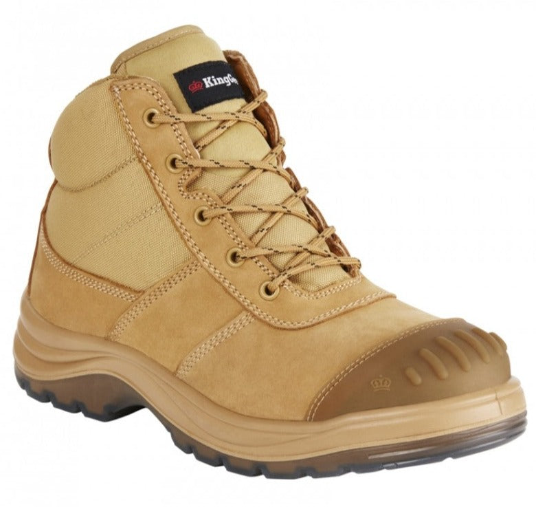 The King Gee Tradie Zip Safety Boot K27100 features a tan finish with a rugged slip-resistant rubber sole, reinforced steel toe cap, brown laces, and padded collar for comfort. A brand label adorns the tongue.