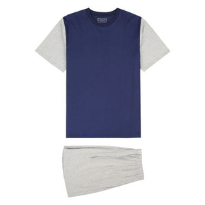 The Koala Nitelife Knit PJ Short Leg Set is a summertime pajama set made from 100% cotton. It features a blue short-sleeve shirt with light gray sleeves and matching light gray shorts. Both the shirt and shorts are displayed flat on a white background.