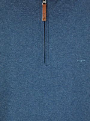 Close-up of the RM Williams Ernest Sweater in blue wool, featuring a quarter-zip neck with a brown leather pull tab marked "P.M." and an embroidered horned longhorn logo on the left chest.