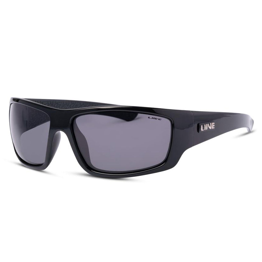 A pair of sleek, black Liive Kuta Polar Sunglasses with dark tinted lenses. These sunglasses feature a bold frame crafted from lightweight polycarbonate and display the brand name "LIVVE" on the temples in silver letters. The overall design is modern and stylish, offering full coverage for the eyes.