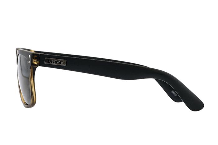 Side view of a pair of Liive L.D Polar Sunglasses with glossy black arms and dark, polarised lenses. The frame has a subtle hint of gradient brown towards the front. The left arm features a metallic accent with the brand name "Liive" engraved on it, ensuring both style and UV protection.