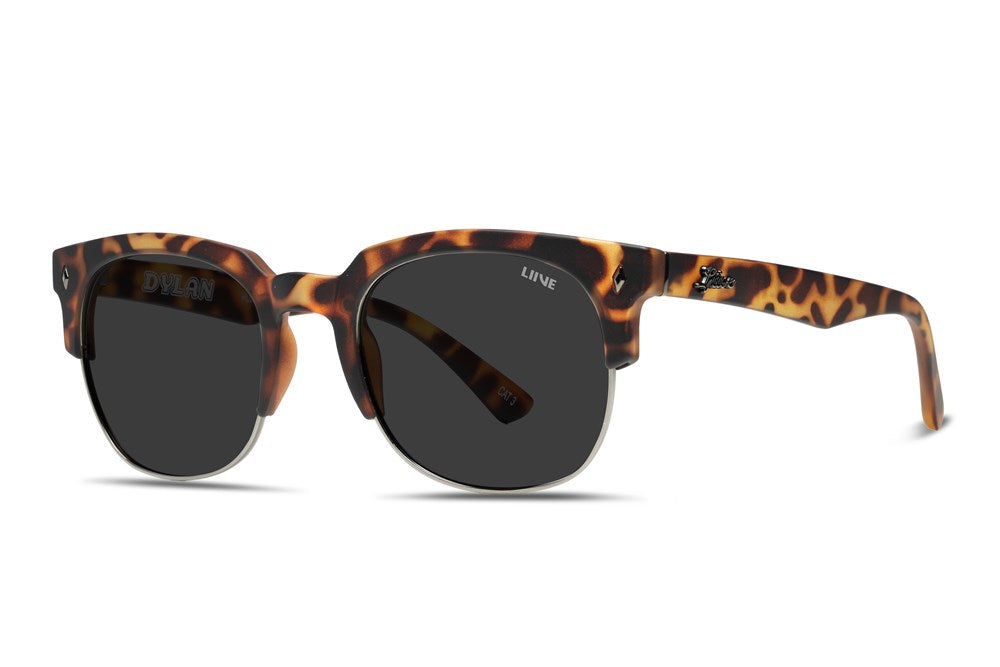 The Liive Dylan Polar Sunglasses feature a tortoiseshell frame with dark, polarized lenses. The lightweight, partially translucent polycarbonate frame showcases a blend of brown and amber hues, with the brand name visible on the temples.