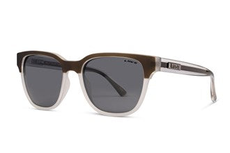 The Liive Billy Polar Sunglasses feature a transparent frame with a gradient color that transitions from dark brown at the top to clear at the bottom. These stylish sunglasses have lightweight polycarbonate lenses that are dark, rectangular, and polarized grey, providing full coverage and UV protection. The brand logo is visible on the temples.
