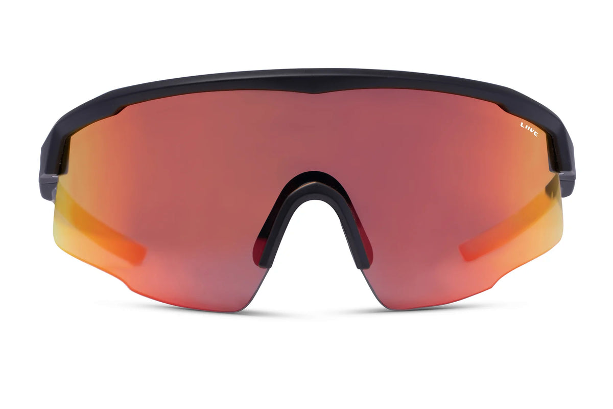 The Liive Dealer Mirror Sunglasses are sleek with black frames and large, reflective orange-tinted polycarbonate lenses. They have a nose bridge and provide UV protection, perfect for outdoor activities.