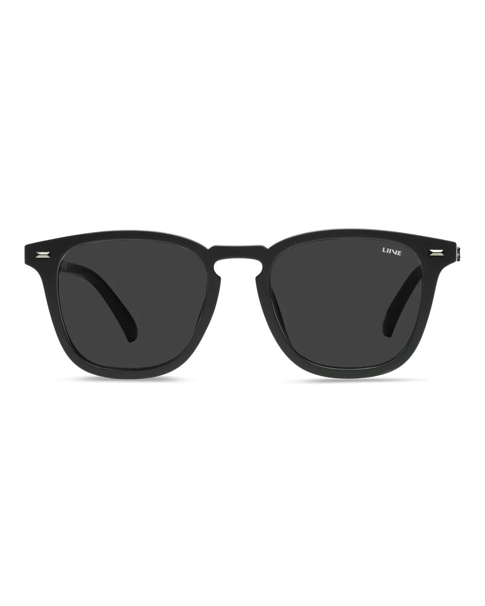 Liive Manhattan Sunglasses feature black rectangular frames crafted from polycarbonate, dark lenses, a thin bridge, and UV protection for sleek style. Perfect for an effortlessly cool look while shielding your eyes.