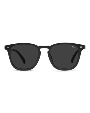 Liive Manhattan Sunglasses feature black rectangular frames crafted from polycarbonate, dark lenses, a thin bridge, and UV protection for sleek style. Perfect for an effortlessly cool look while shielding your eyes.