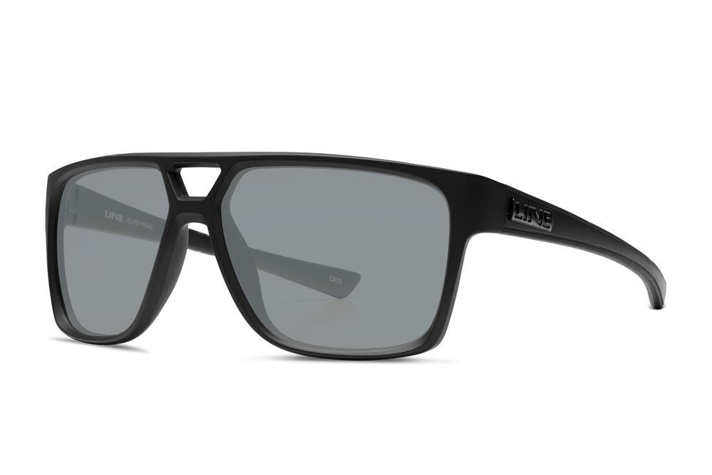 Liive Elvis Sunglasses feature black, rectangular frames with dark UV-protective lenses, a slight frame gap above the bridge, and are made from lightweight polycarbonate. The brand "LINE" is visible on the arms, embodying a sleek style reminiscent of classic Elvis sunglasses.