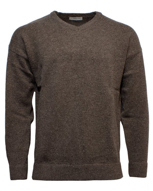 The Landline V-Neck Jumper, a plain brown knit sweater with long sleeves and a classic V-neck collar, is displayed against a white background, showcasing its cozy warmth and timeless winter style.