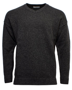 The Landline V-Neck Jumper is a plain, long-sleeved, dark gray jumper with a V-neckline, crafted from rugged wool and shown on a white background.