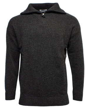The Landline Zip Neck Jumper is a dark grey, long-sleeve wool sweater featuring a high collar and short zip neck, shown on a plain white background—ideal for anyone looking for a warm and durable winter garment.