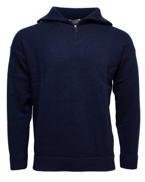 The Landline Zip Neck Jumper is a dark blue long-sleeve wool sweater with a half-zip collar, shown on a plain white background. Ribbed cuffs and hem add durability, making it an ideal winter wardrobe piece.