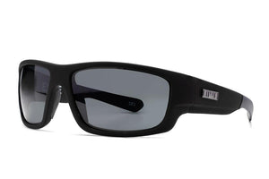 A pair of black, rectangular-frame Liive Exile Sunglasses with dark tinted, polarized lenses. The arms are straight and feature a small, metallic detail near the hinge on the left arm. The lenses provide UV protection and are labeled "CAT 3." These stylish sunglasses are positioned at an angle against a white background.