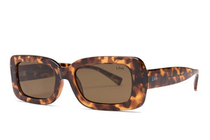 Liive Crush Sunglasses feature a tortoiseshell rectangular design with dark polycarbonate lenses offering UV protection. The glossy frame has a marbled brown pattern, and the arms subtly display the logo.