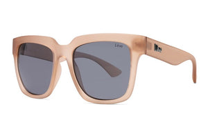 Introducing Liive Layla Sunglasses: These chic glasses feature a matte pink thick frame with dark rectangular, optically correct lenses that offer UV protection. A small logo graces the temple, adding an elegant touch.
