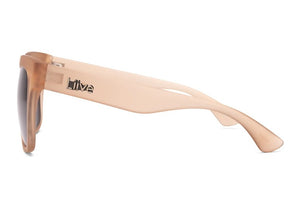 The Liive Layla Sunglasses boast a sleek beige frame with optically correct lenses for clear vision. The temple features the brand name "Liive" in metallic lettering, adding to their modern style.