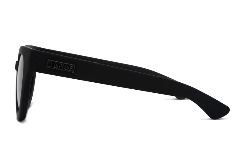 A side view of a pair of Liive Rumble Polar Sunglasses showcases their sleek and modern design. The thick, black frame features the brand name "Liive" engraved on the left temple. These sunglasses come with dark, polarised lenses that offer enhanced clarity and UV protection, ensuring both style and safety.
