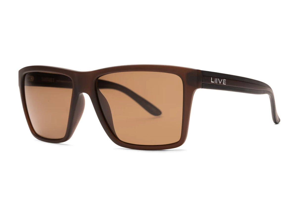 The Liive X Sabotage X Polar Sunglasses boast a matte brown frame with rectangular brown lenses, blending modern minimalism and lightweight comfort. Dark temples transition to a beige gradient near the hinge, featuring the "LIIVE" brand name in white.