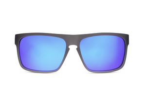 The Liive Voyager Mirror Polar Float Sunglasses showcase a modern and sleek design with black frames and reflective blue lenses, viewed from the front against a white background. These sunglasses feature UV protection and include a small notch in the center of the frame above the nose bridge.