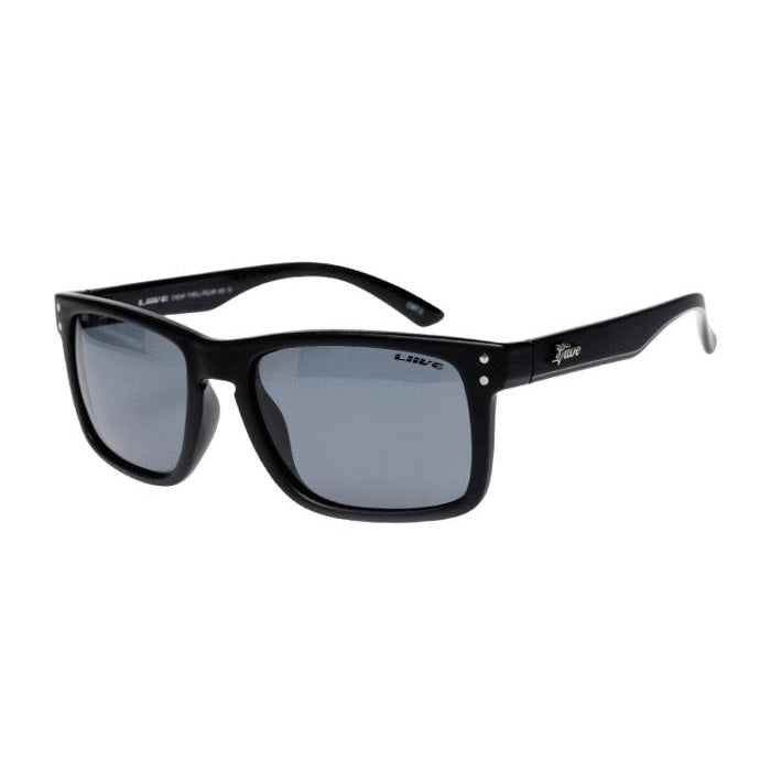 The Liive Cheap Thrill Polar Sunglasses are a stylish pair featuring black frames with square lenses and lightweight polycarbonate construction. The temples are adorned with a subtle white logo near the hinges. Outfitted with grey polarized lenses, these sunglasses provide excellent shade from sunlight, making them ideal for any sunny day adventure.