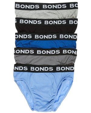 A vertical stack of five men's Bonds Elastic Waist Briefs with "BONDS" written on the elastic waistbands. The colors from top to bottom are gray, black, navy blue, royal blue, and dark gray.