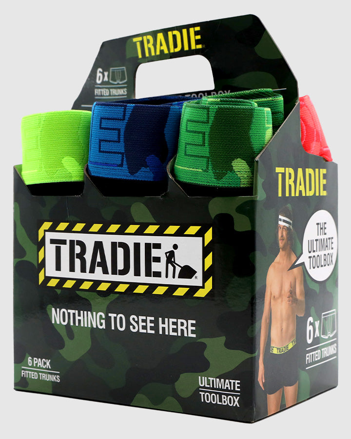 The "Tradie Mens 6PK Trunk" offers comfort with vibrant colors such as red, blue, green, and camouflage. Made from Cotton/Elastane, it features packaging with a camouflage pattern and slogans like "Nothing to see here" and "The Ultimate Toolbox.