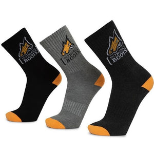 Three pairs of crew socks from the Mongrel 5 Pack Cotton Socks collection are displayed in a row: one black, one gray, and one dark gray. Each pair features orange toes and heels and a yellow and black logo with the text "Monkey Boots" at the top front of these premium cotton socks for added comfort.