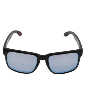 These Oakley Holbrook Polarized sunglasses feature sleek black frames with reflective blue lenses, a subtle glossy finish, and curved arms for comfort. Combining functionality with timeless design, they offer the added benefit of polarization.