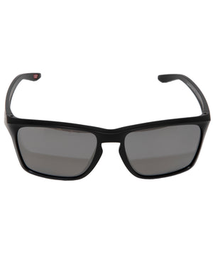 A pair of Oakley Sylas Polarized sunglasses in black, featuring dark-tinted Prizm lens technology and a sturdy plastic frame with slightly curved arms, shown against a plain white background.