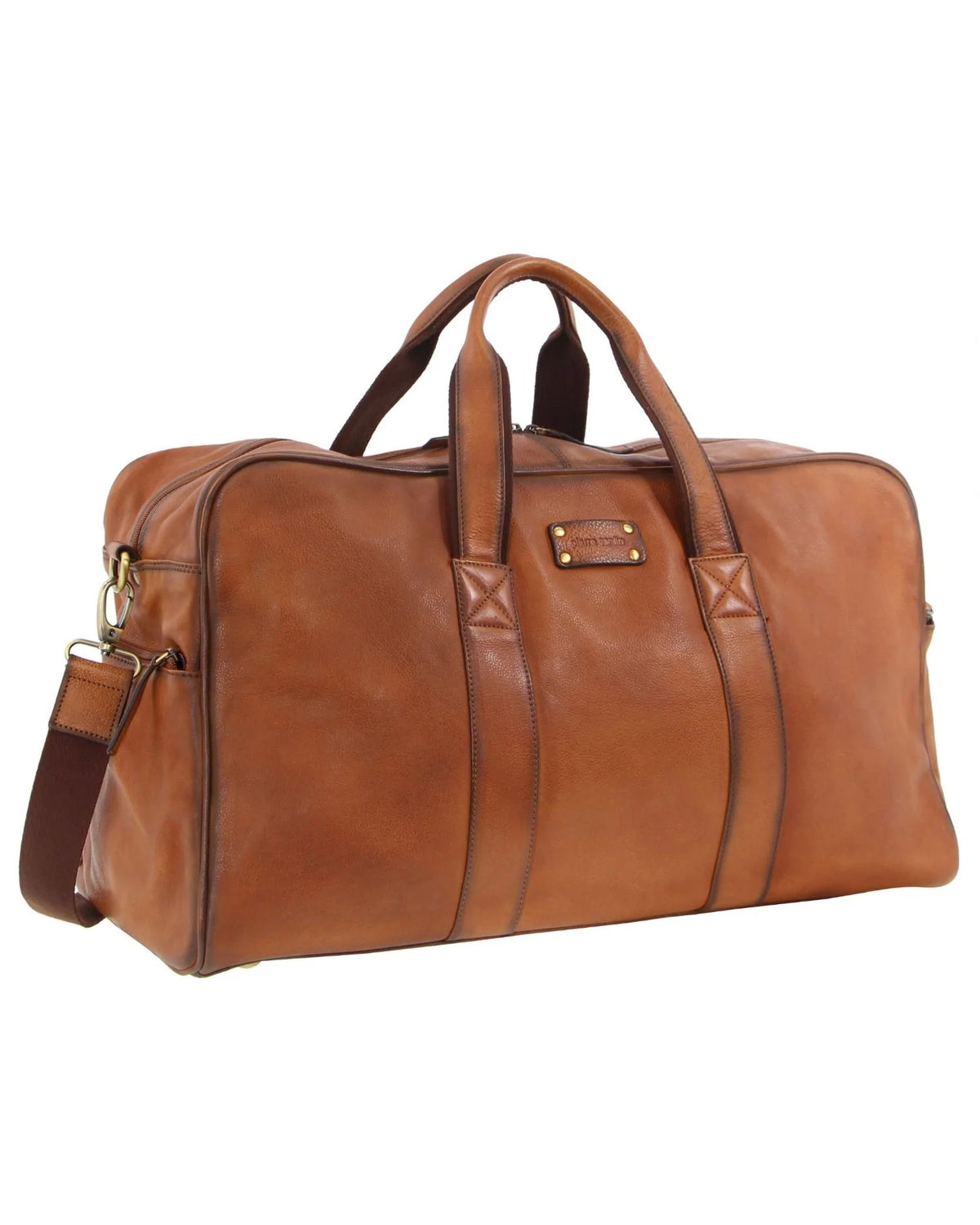 The Pierre Cardin Leather Travel Bag features a sleek brown leather design with two handles, an adjustable shoulder strap, gold-tone hardware, minimal stitching, and a small label on one side. Inside, it offers multiple pockets for organized storage of your essentials.