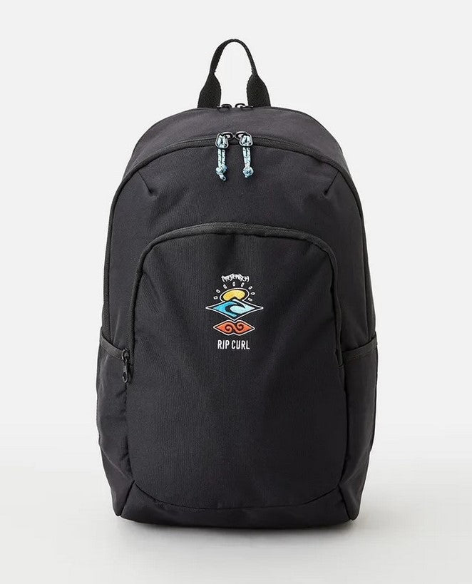 The Rip Curl Ozone 30L Icons Eco Backpack, made from recycled plastic, features a colorful logo on the front pocket, a laptop section, a front zipper pocket, two side pockets, and blue zipper pulls on the main compartment. The background is plain white.