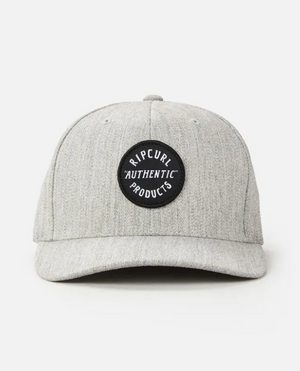 The Rip Curl Wetty Snap Back Cap is gray with a curved brim, featuring a black circle patch with "RIPCURL AUTHENTIC PRODUCTS" in white, and an adjustable strap for a custom fit. It is shown against a plain white background.