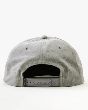 The image depicts the back of a gray Rip Curl Wetty Snap Back Cap, featuring a soft fabric with a top button and a plastic adjustable strap for sizing. The background is plain white.