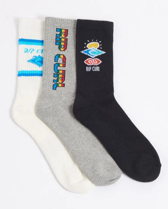 Displayed are three pairs of socks from the Rip Curl Icons Sock 3 Packβone pair is white with a blue logo, another is grey with a colorful text logo, and the third pair is black featuring a geometric sun and wave design. These casual style socks are available in a convenient 3 pack.