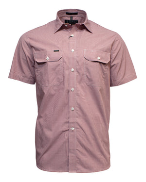 The Ritemate Pilbara Short Sleeve Check Double Pocket Shirt is displayed in a light red or pinkish hue. Made of 100% cotton, this casual shirt features two chest pockets with buttoned flaps and a pointed collar. The fabric appears lightweight and slightly textured for ultimate comfort.