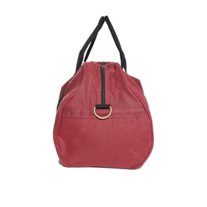 The Ringers Western Dusty Duffle Bag is a red rectangular bag with black handles and adorned with a gold ring on the front. Made from heavy-duty waxed canvas, it features a prominent zipper running from front to back. The sturdy fabric and black-stitched handles guarantee both durability and style.