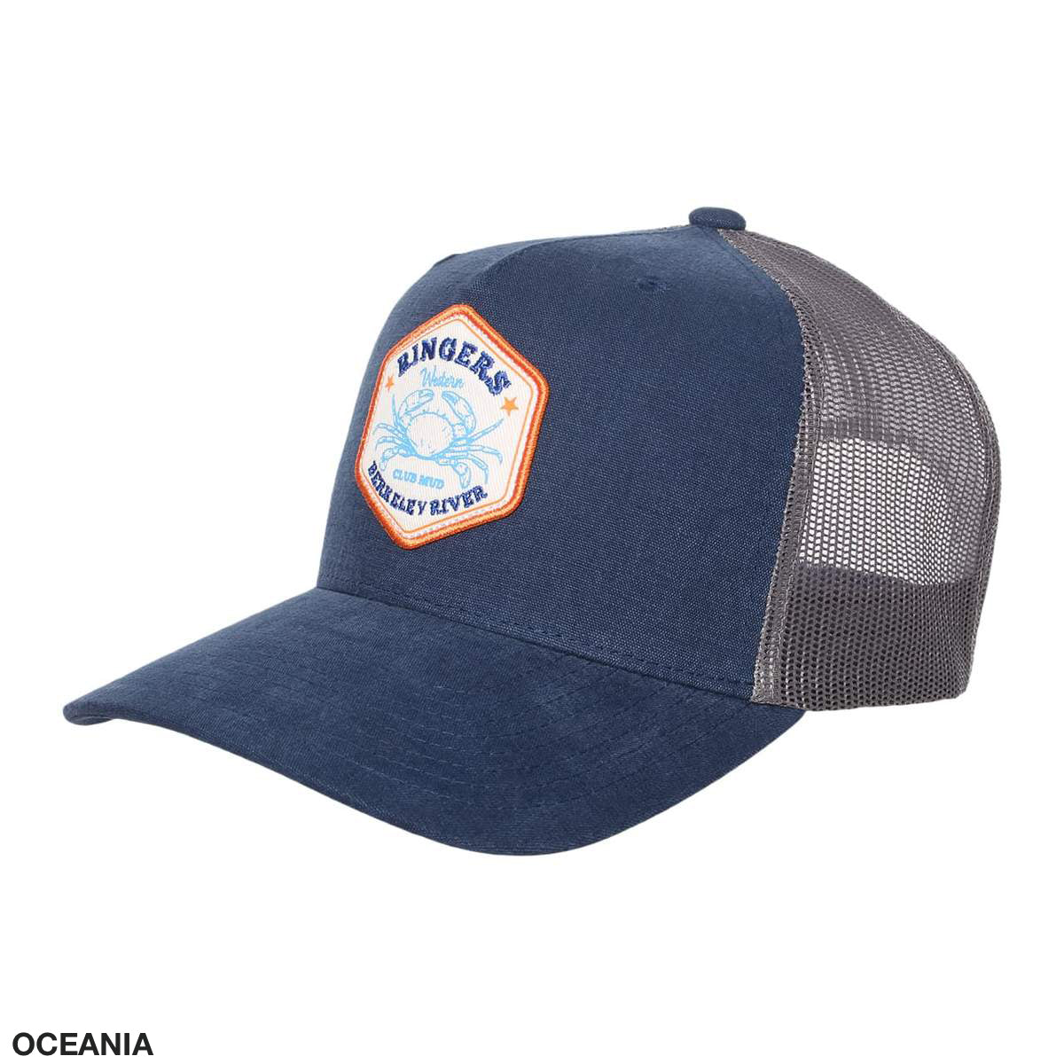 The Ringers Western Club Mud Trucker Cap is a stylish combination of navy blue and gray. It features a front patch that reads "Ringers Western Kimberley River" and showcases two crossed bull horns. The cap has a solid fabric front with mesh back and sides for breathability, and an adjustable strap ensures a comfortable fit. The word "Oceania" is featured in the bottom left corner.
