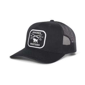 The Ringers Western Shotgun Trucker Cap is a black cap featuring a white patch on the front with a design that includes the text "Ringers Western Est. 2012" and an illustration of a bull with crossed guns. The cap has a black mesh back and an adjustable strap for the perfect fit.