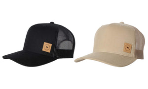 Two Patch Trucker Caps are displayed side by side. The left hat, a Ringers Western Patch Trucker Cap, is black with a mesh back and a small brown logo patch on the front. The right hat is beige with similar features, including an adjustable strap for comfort.