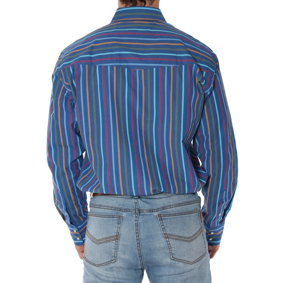 A person is shown from the back wearing a Ringers Western Wyoming Shirt, a blue long-sleeve semi-fitted shirt with vertical multicolored stripes, made from 100% cotton. The shirt is tucked into light blue denim jeans, and the person's medium-length hair completes the casual look.