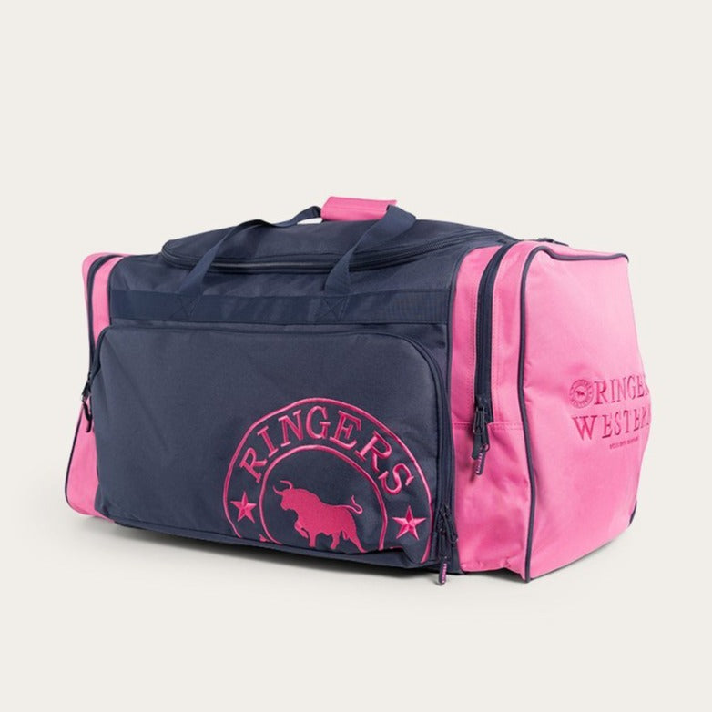 The Ringers Western Rider Sports Bag is a stylish duffel bag featuring dark blue and pink sections. It showcases the "Ringers Western" logos and text on the front pocket and side panels, along with a bull silhouette. The bag also includes handles and a shoulder strap for versatile carrying options.