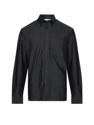The RM Williams Collins Shirt in black features long sleeves, a classic collar, buttoned cuffs, a chest pocket, and a button-up front. Made from a quality wool blend and shown on a white background.