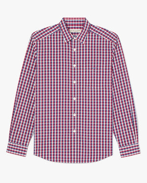 The RM Williams Collins Shirt is a long-sleeved, 100% cotton button-up with a red, white, and blue checkered pattern, pointed collar, and chest pocket.